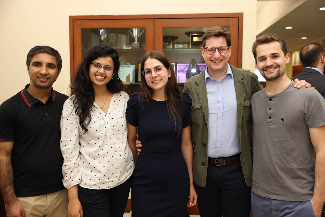 Students posing for a group photo at the Justice Breyer event reception