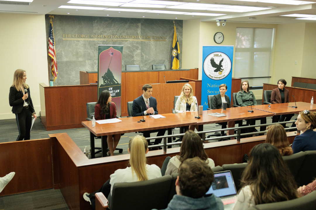 The alumni panel talking to the crowd in the moot courtroom