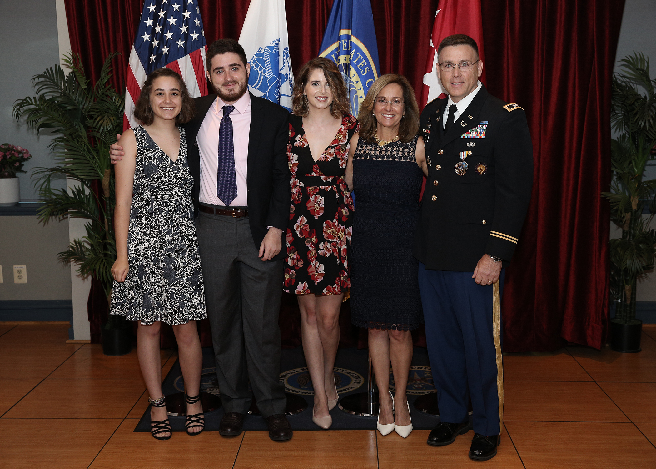 Gary's Army retirement photo with his wife and children