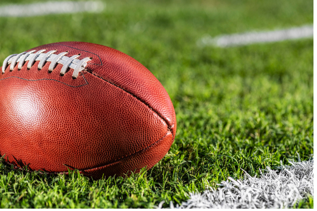 An American football on a field