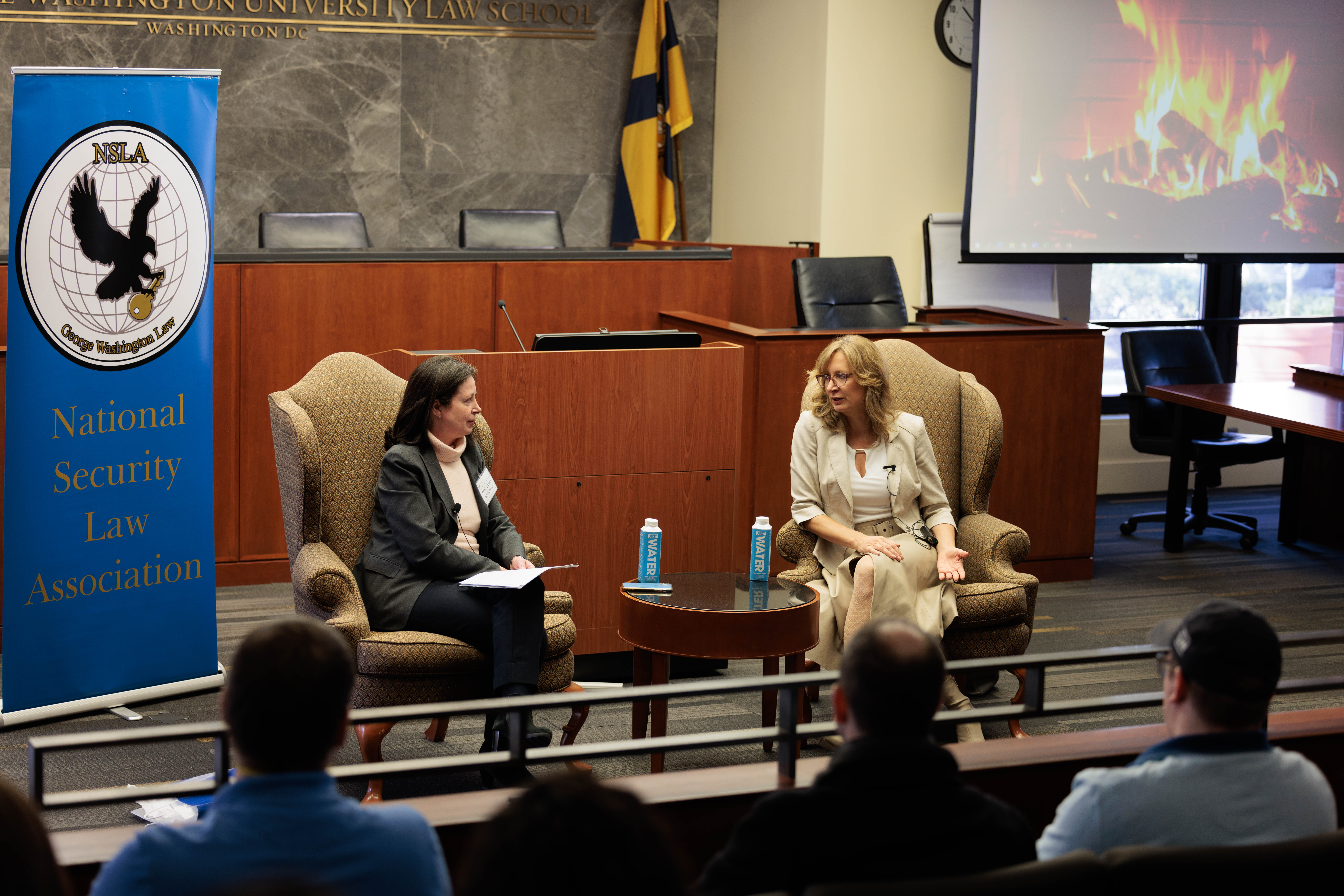 Professor Laura Dickinson and Ambassador Van Schaack talking