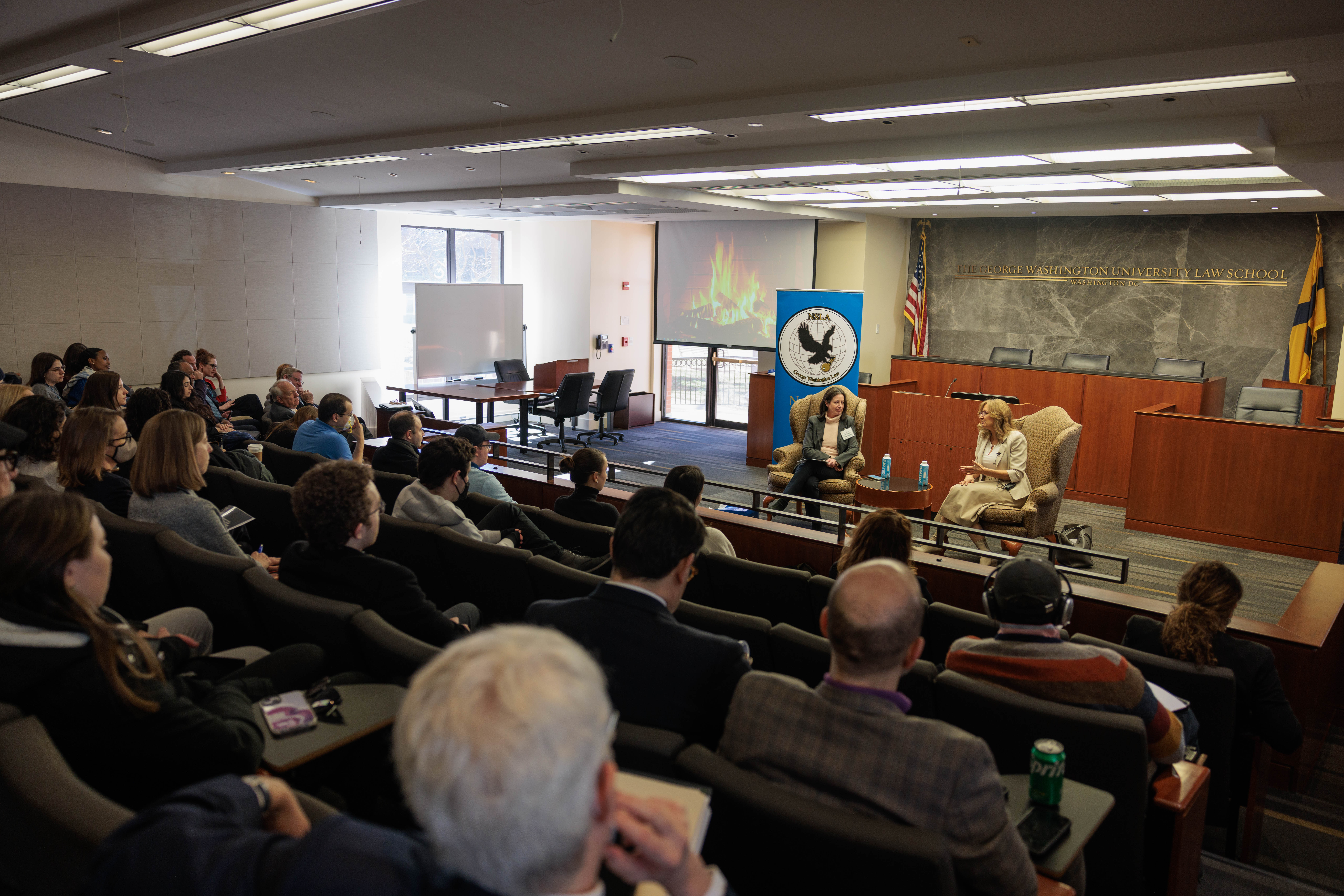 A crowd listening to Ambassador Van Schaack speak