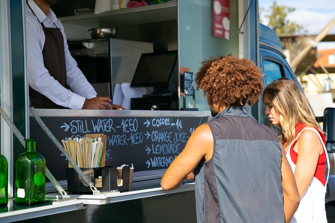People ordering food at a food truck
