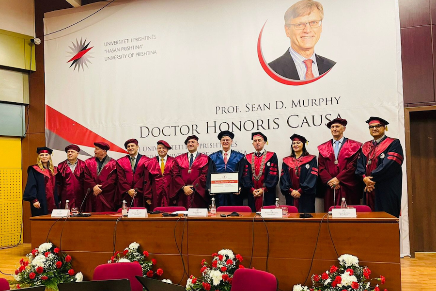 Professor Murphy holding his honorary degree with the Rector, Vice-Rectors, and Deans of the University of Prishtina