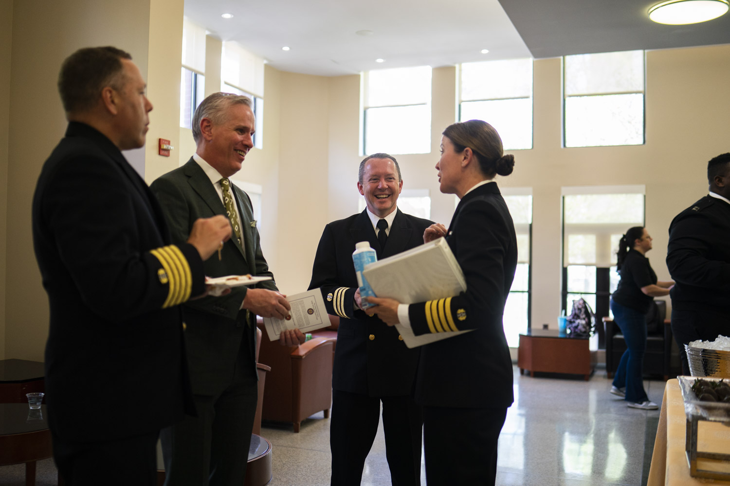 Military members talking to a professor