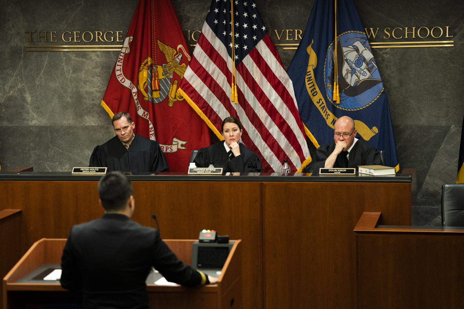 The judges listening to the person on the stand