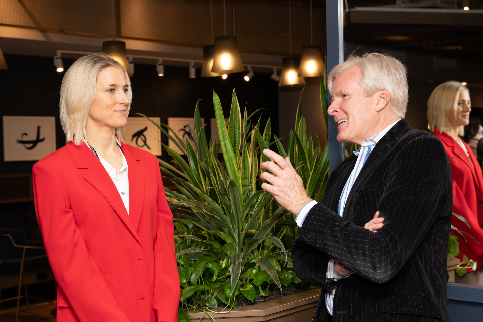 Robert Brauneis talking to a woman