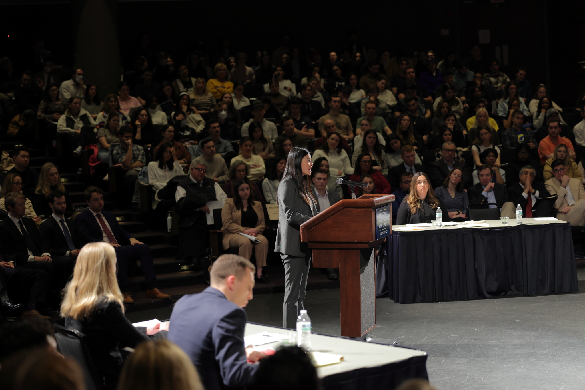 Tessa Lasser standing behind a lectern giving her oral argument