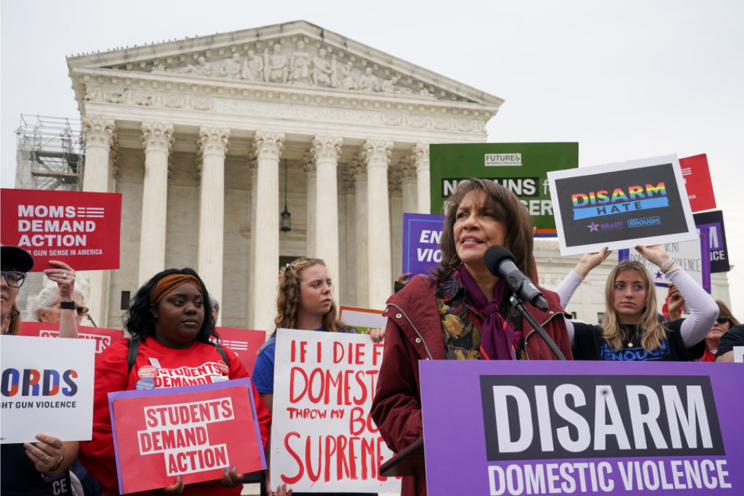 Ruth Glenn, president of Survivor Justice Action, addresses at a rally in front of the Supreme Court to call on the justices to disarm domestic violence perpetrators and protect survivors