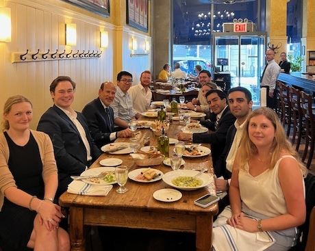 GWNY students sitting at a restaurant table with Professor Jeffrey Kohn