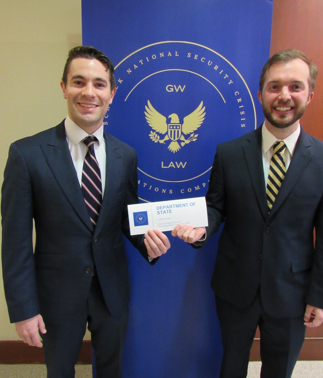 Zack Minsk and John Hollander, Class of 2026 Zack Minsk and John Hollander holding a Department of State sign