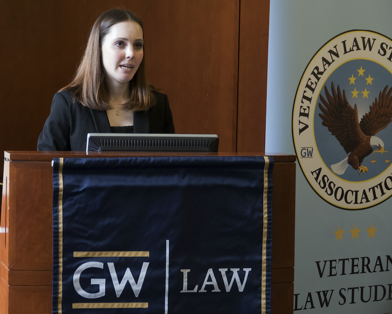 A GW Law student talking at a podium