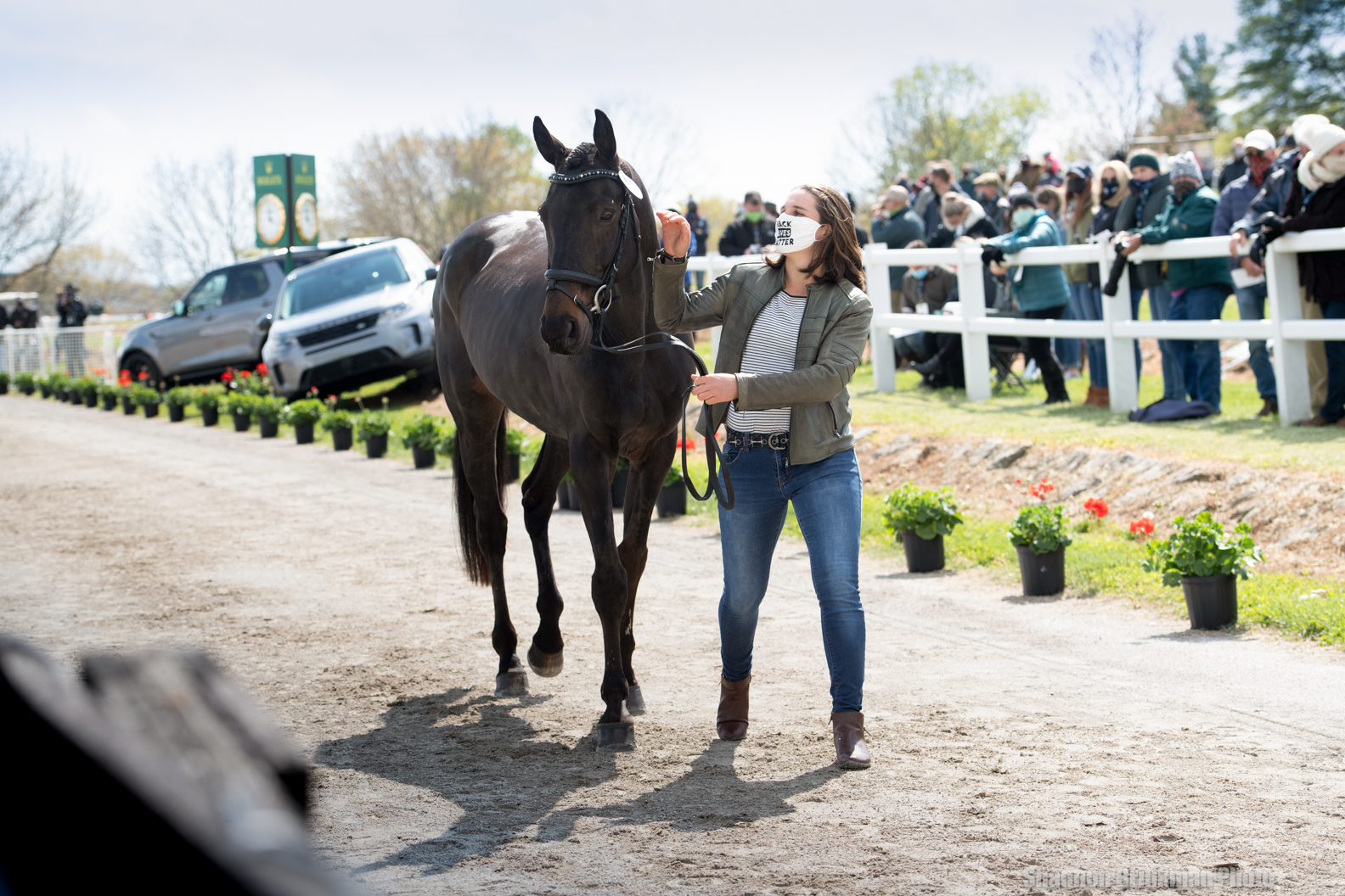 Ema Klugman walking next to a horse