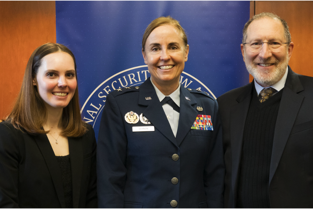 A student, Maj. Gen. Vernon, and Dean Schooner