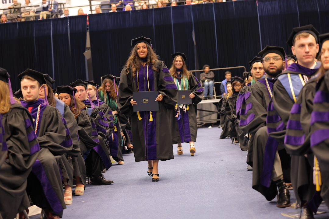 A law graduate walking down the aisle