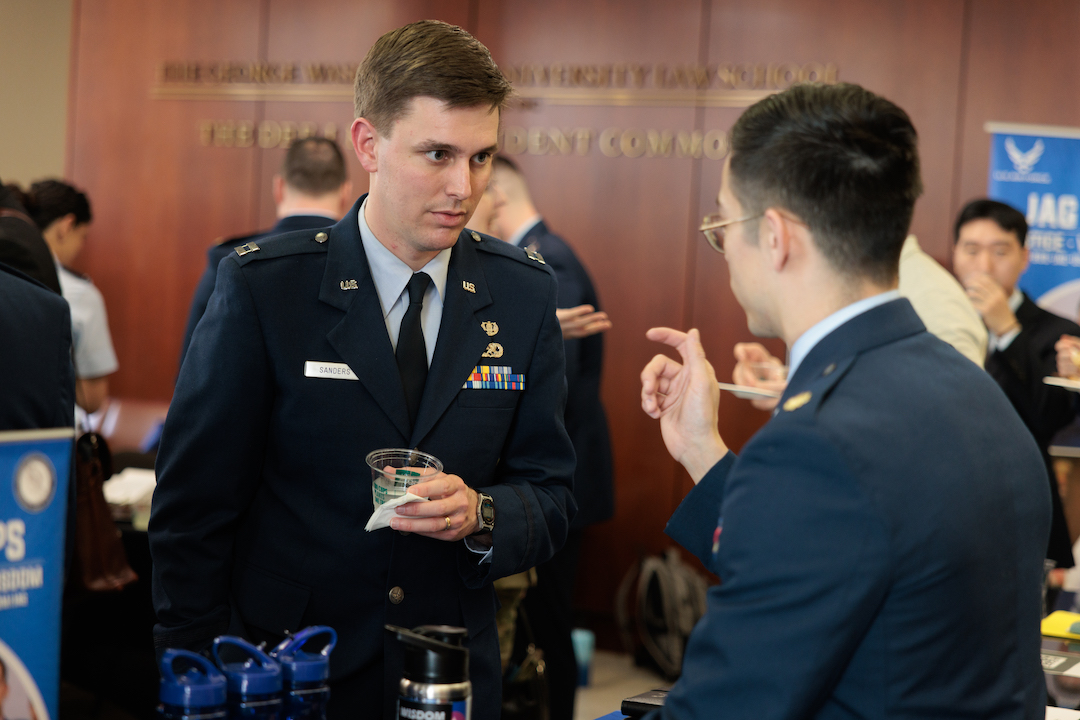 An officer talking to a student