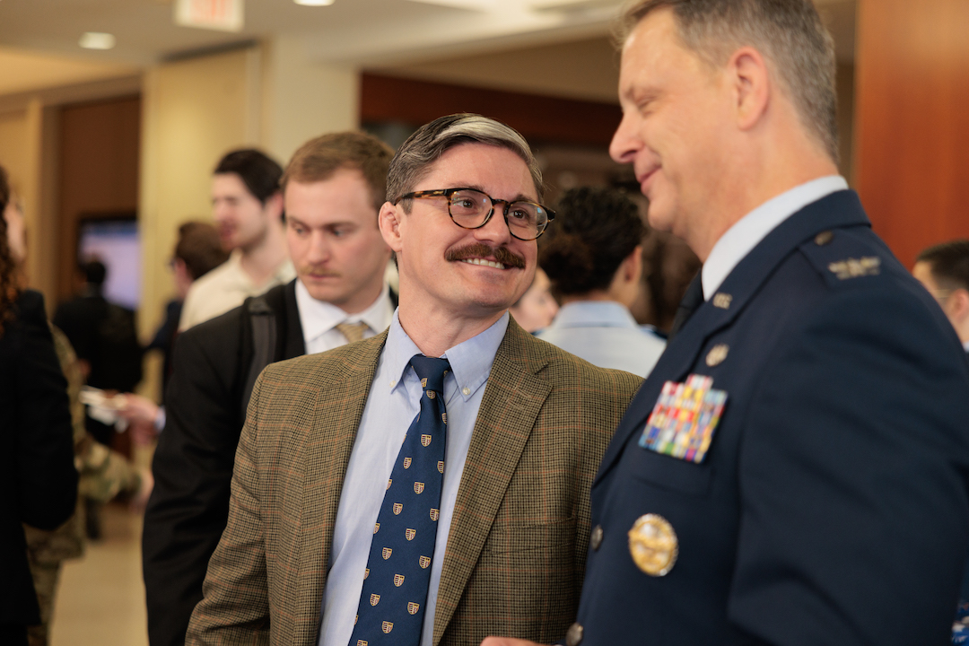 A student smiling at an officer
