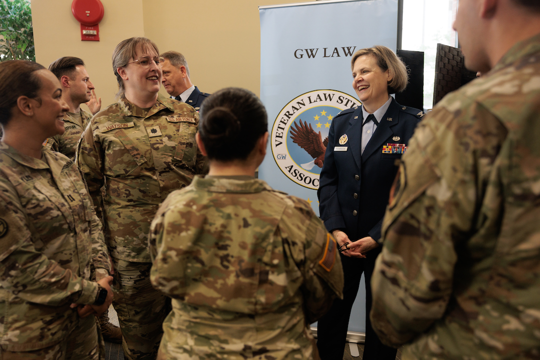 People in uniforms talking in a circle