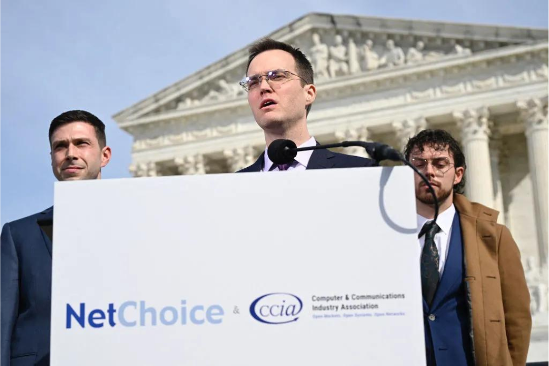 Chris Marchese (L), Director of NetChoice Litigation Center looks on as Matt Schruers (C), President and CEO of the Computer & Communications Industry Association (CCIA), speaks to reporters outside of the US Supreme Court