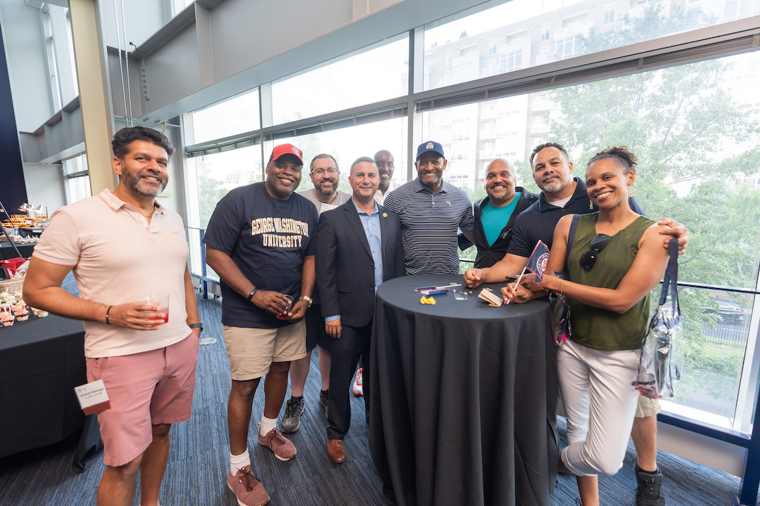 2024 Reunion Weekend Photos A group of alumni posing for a photo at Nationals Park