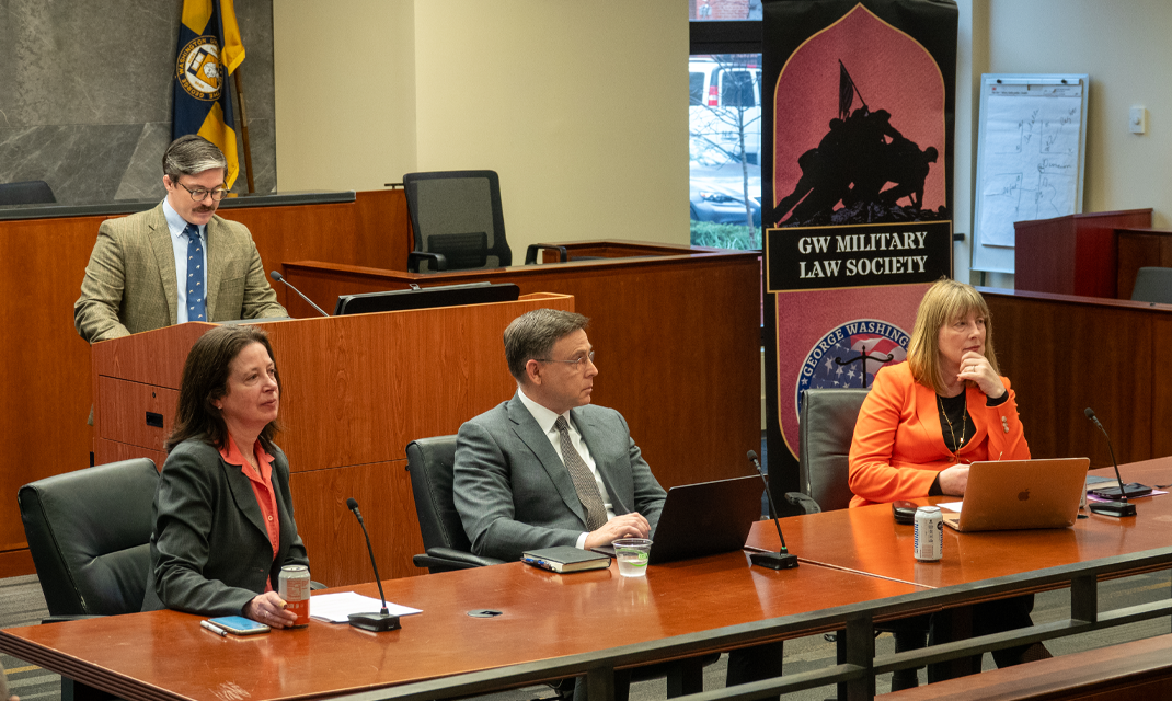 Professor Dickinson hosting a panel in the Burns Moot Courtroom 