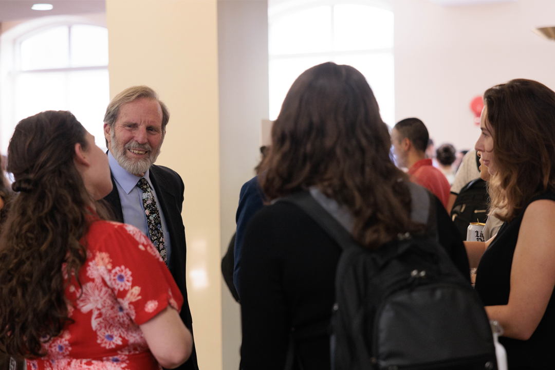Alan Morrison talking with students at a Public Interest Friday event.