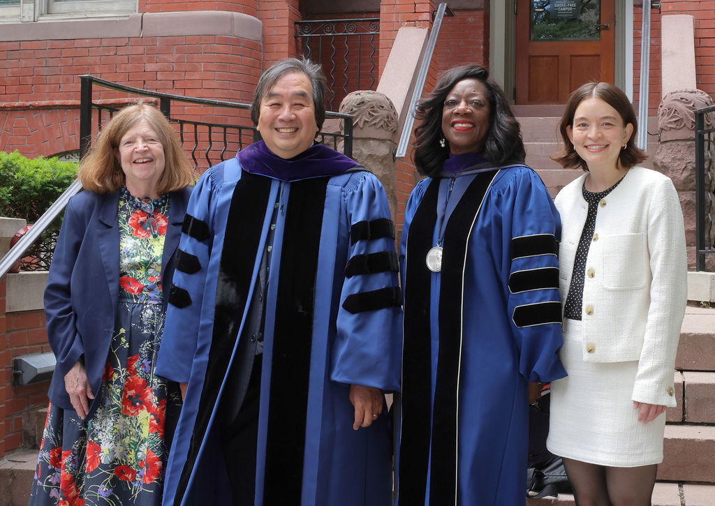 GW Law Dean Dayna Bowen Matthew poses with keynote speaker Harold Hongju Koh and his family.