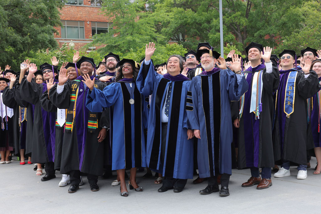 GW Law Dean Dayna Bowen Matthew, Harold Hongju Koh, and Associate Dean Steve Schooner pose with the class of 2025. 
