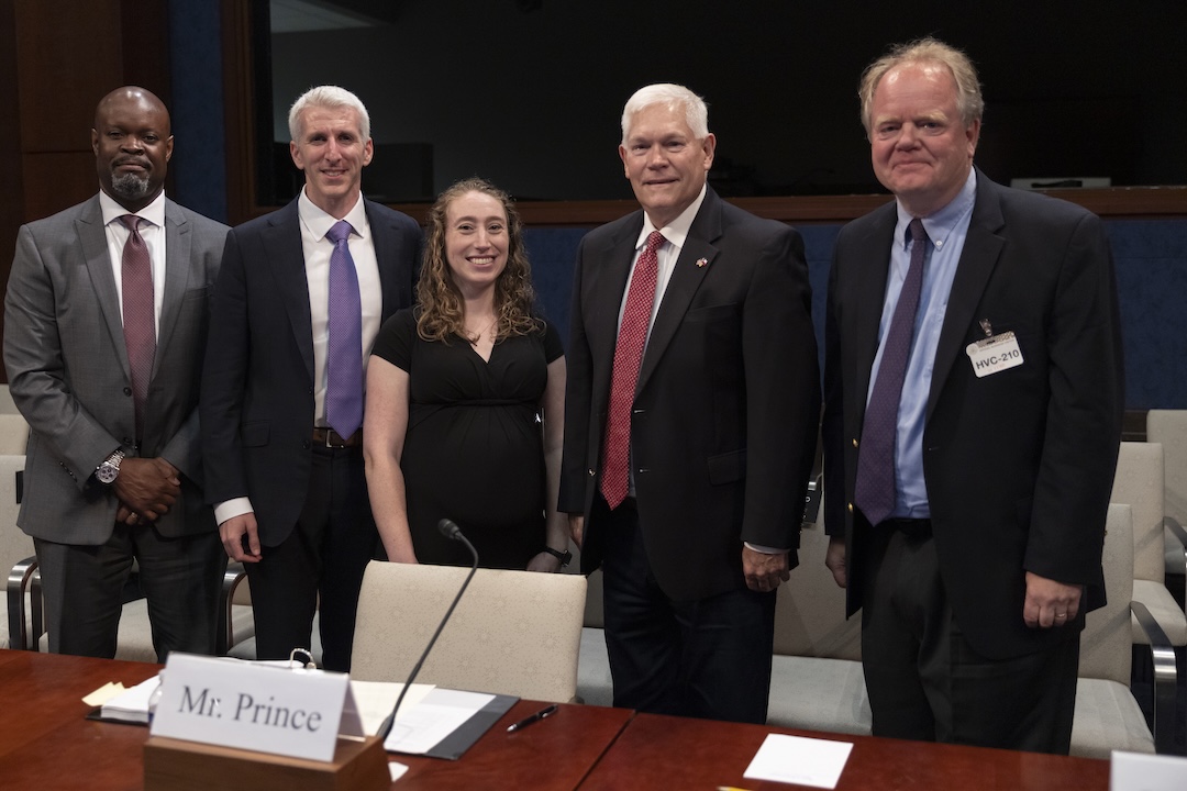 From left: Kenneth Patton, Zach Prince, and GW Law Professor Christopher Yukins pose for a group photo. 