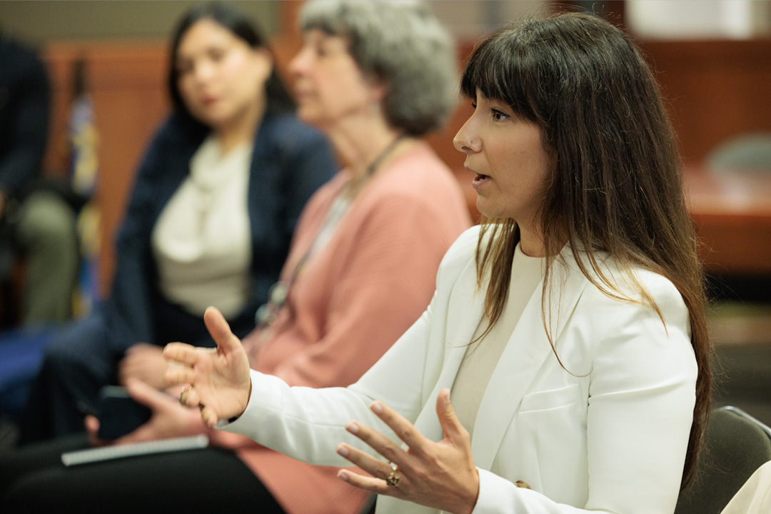 A student speaking in the audience at an Environmental and Energy Law event.