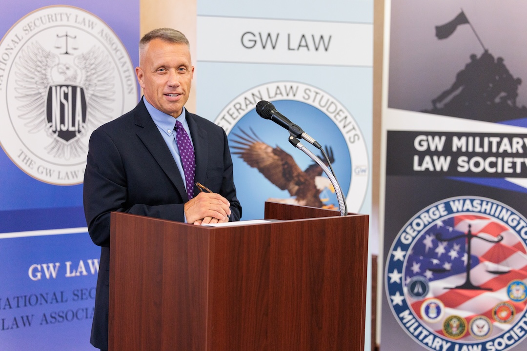 General Stuart Risch stands behind a podium during the veterans welcome back reception.