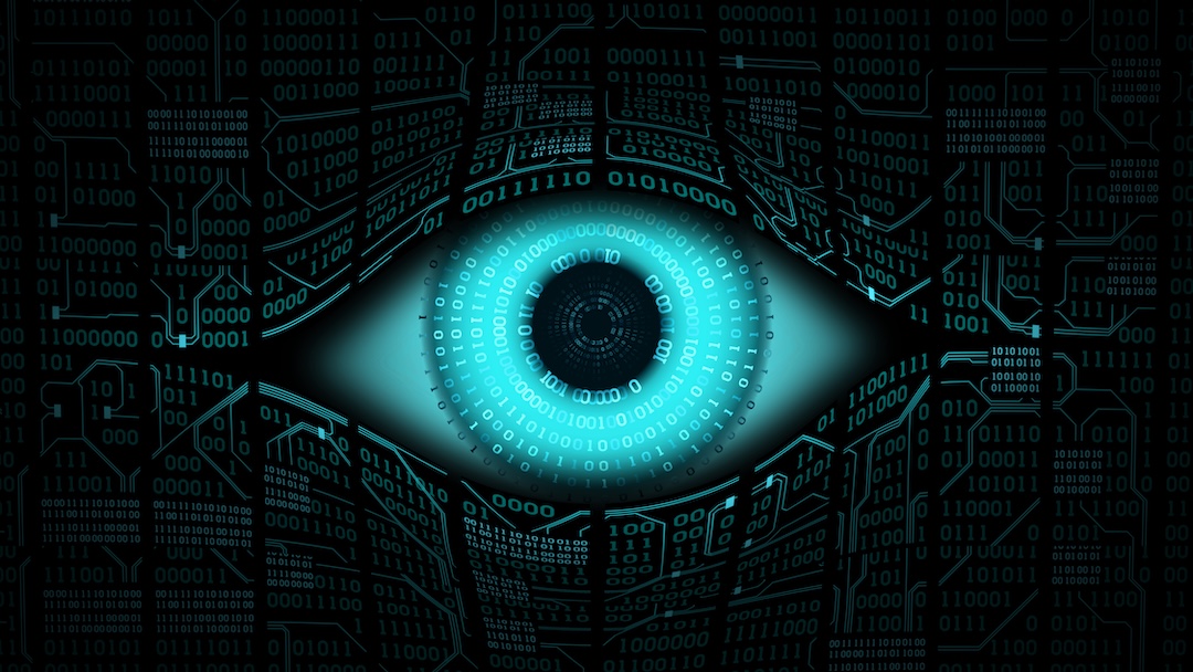 A digital image of an eye ball with computer text and coding surrounding it.