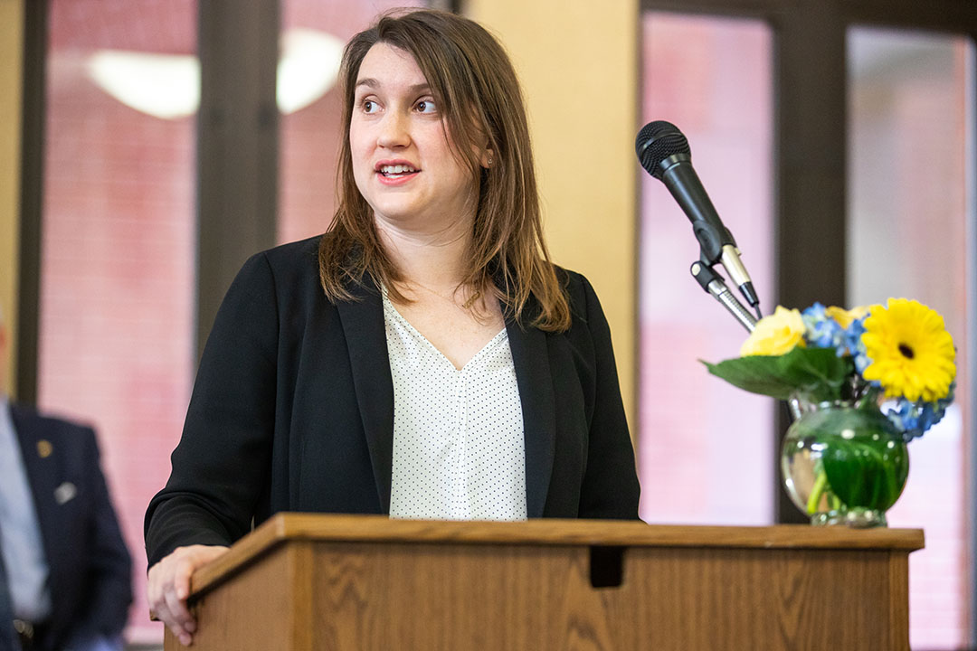 Helen T. Clemens speaks behind a podium.