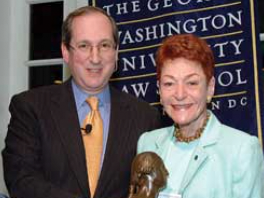 Rooselie Burns (Dean Frederick M. Lawrence presents Dr. Rosalie Burns with a bust of George Washington at a spring dinner of the GW Law School advisory boards)