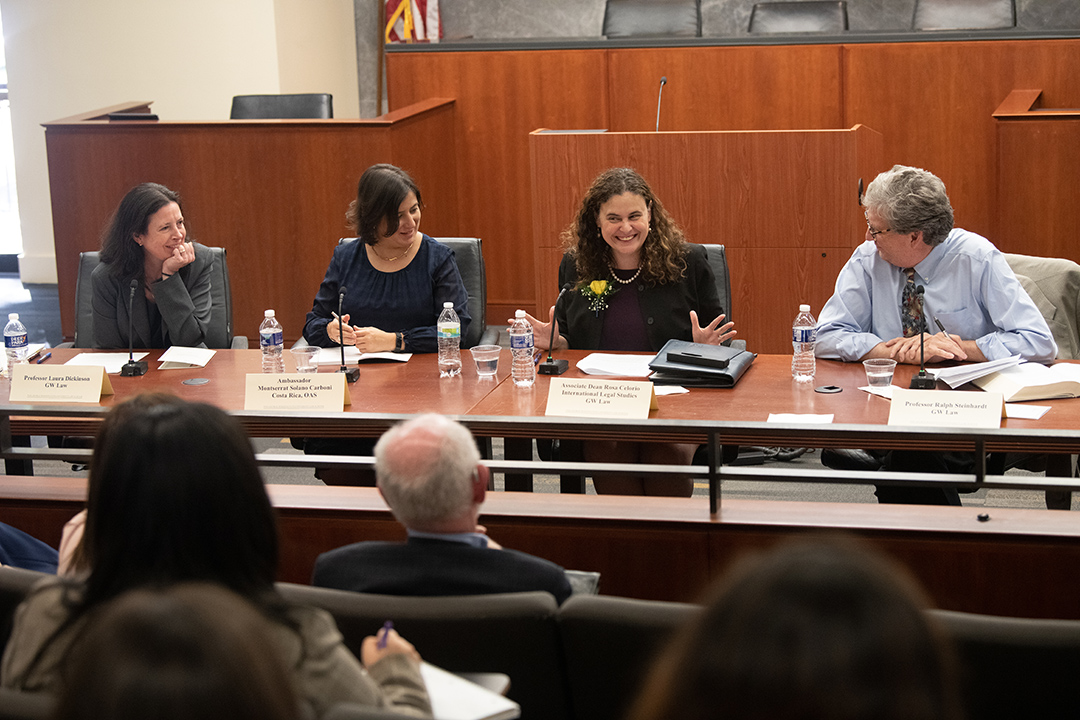 Four legal experts sit on a panel to discuss gender justice and women's rights.