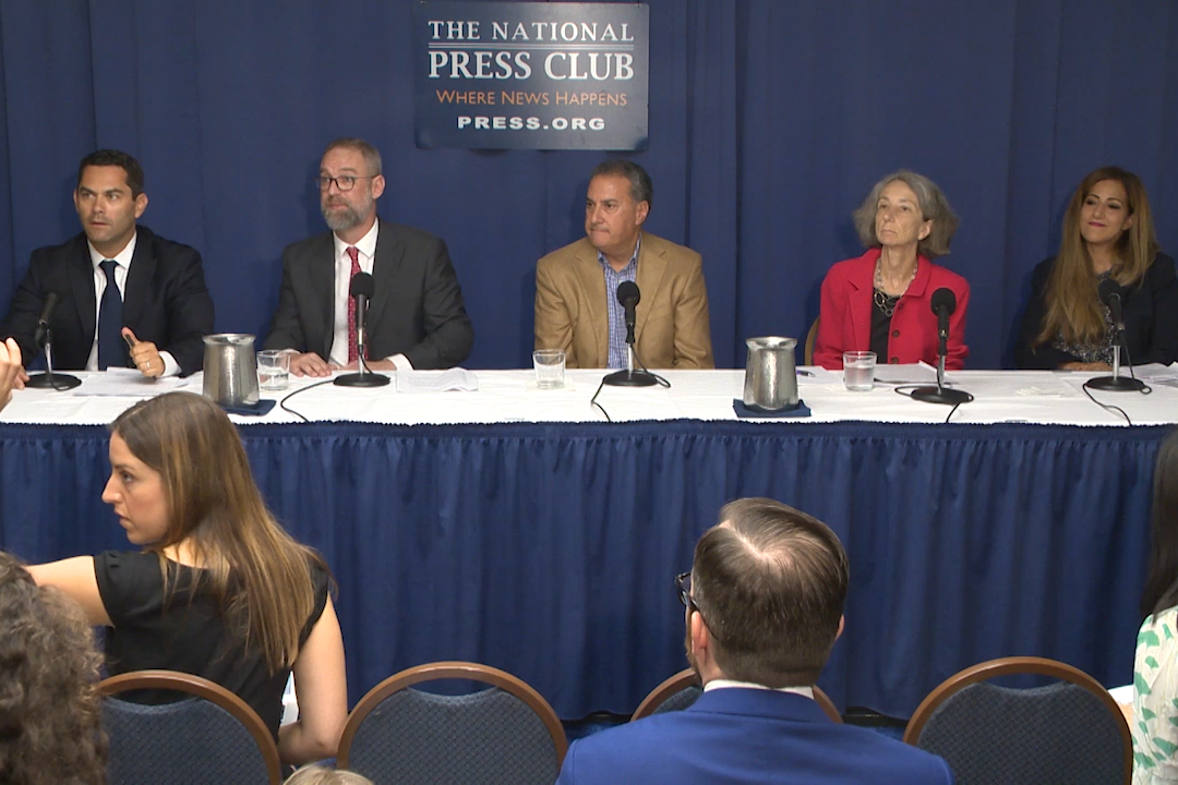 Professor Naomi R. Cahn sits with attorneys and other legal experts for a press conference about an ongoing case surrounding a fertility clinic mix-up.