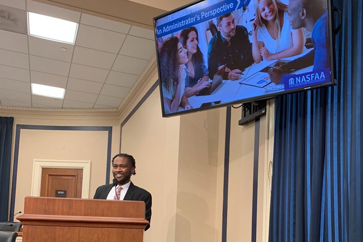 Christopher Pollard speaking to congressional staffers and higher education advocates on Capitol Hill.