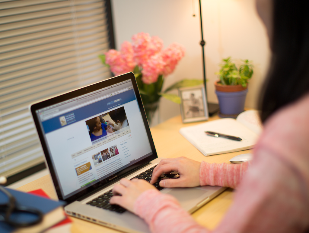 Student in dorm on her computer