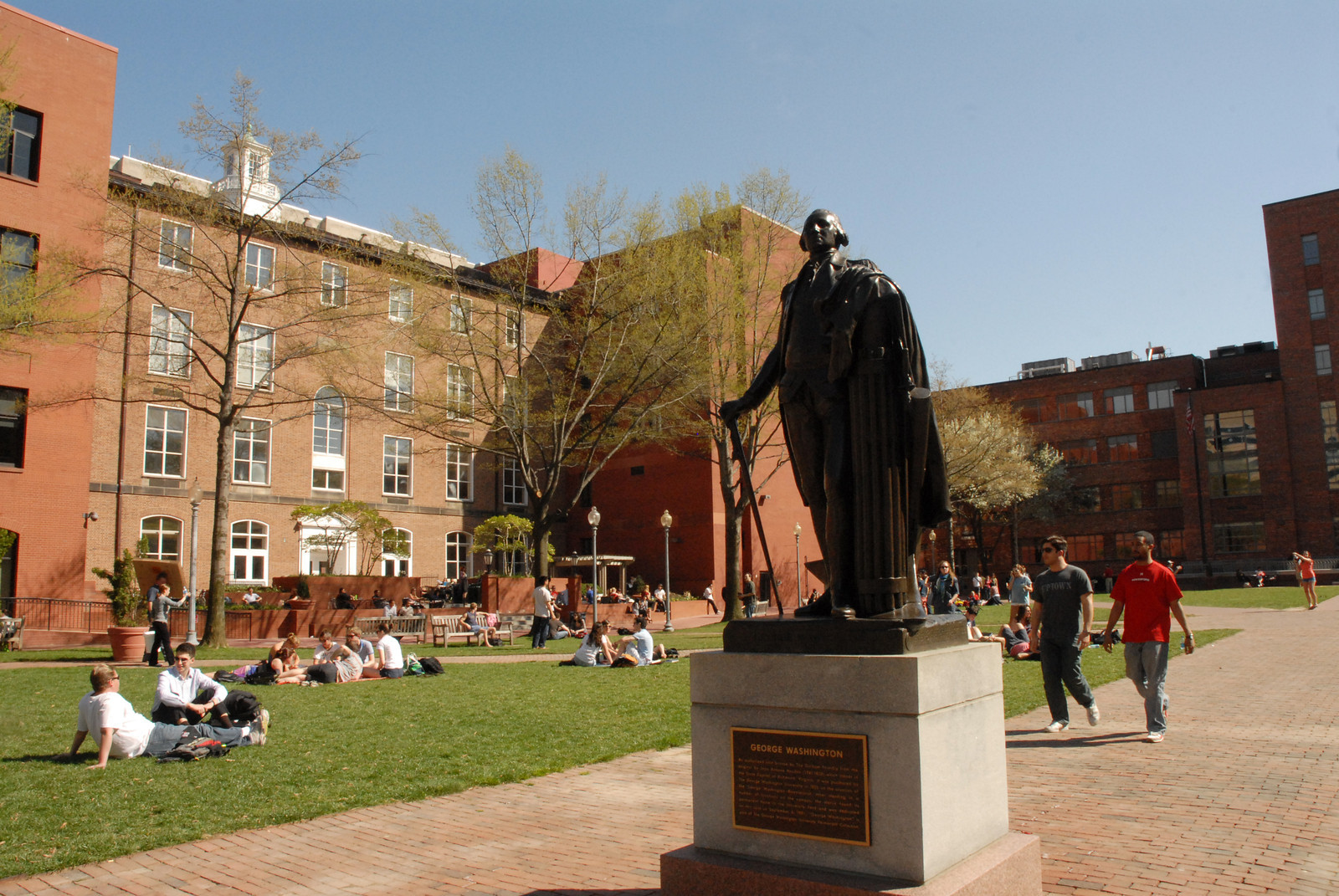 University Yard with students sitting on the grass