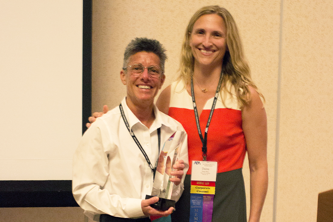 Daina Bray, TIPS Council Member, presents Professor Schaffner with the Hecker Award on October 27, 2019.