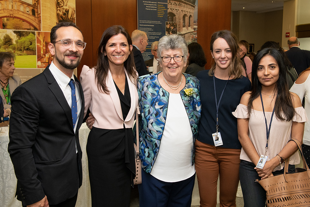 Judge Elizabeth Odio Benito stands with GW Law students.