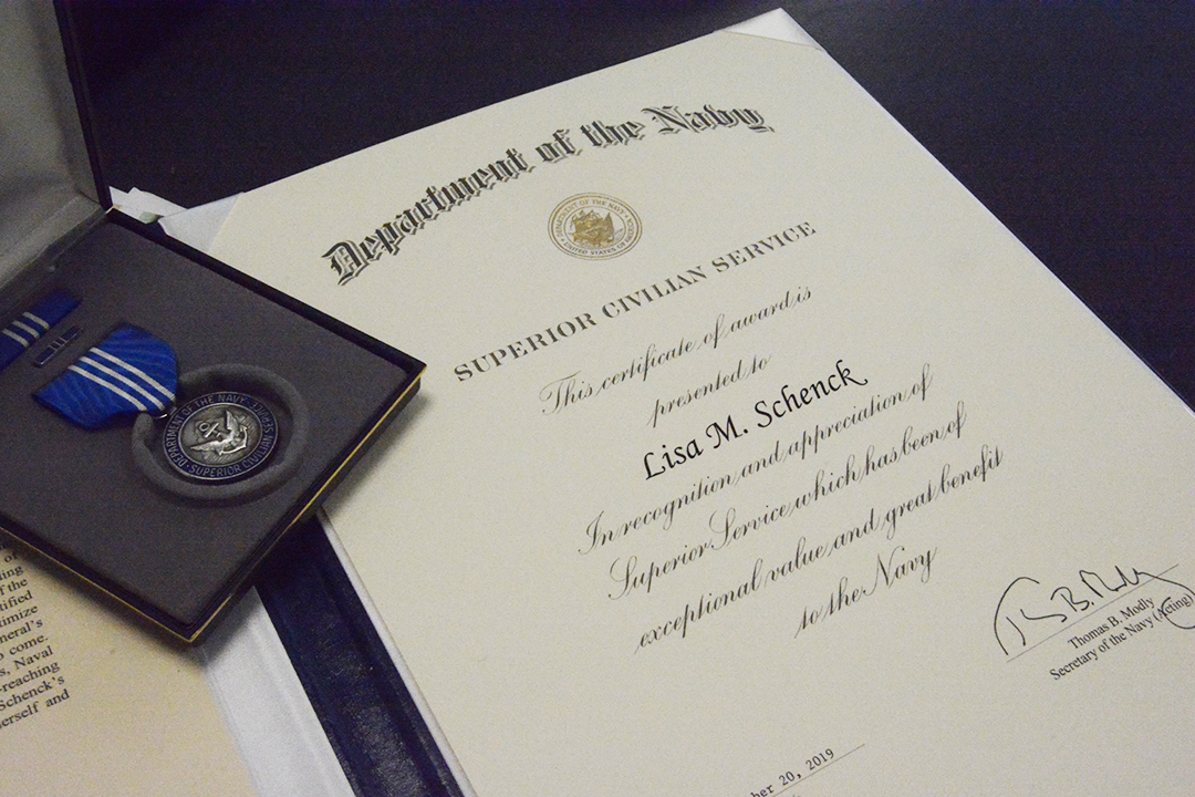 Photo of Associate Dean Schenck's award and medal