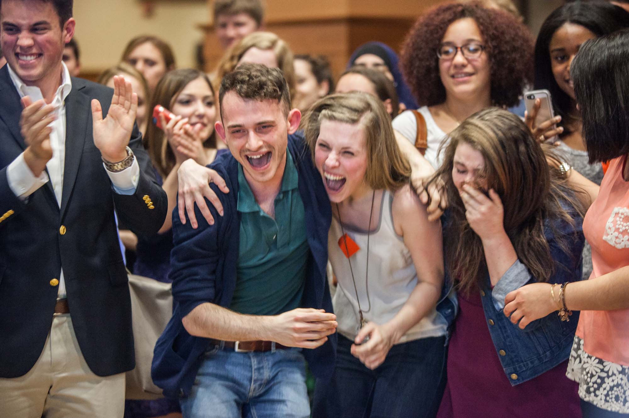 Group of students laughing and smiling