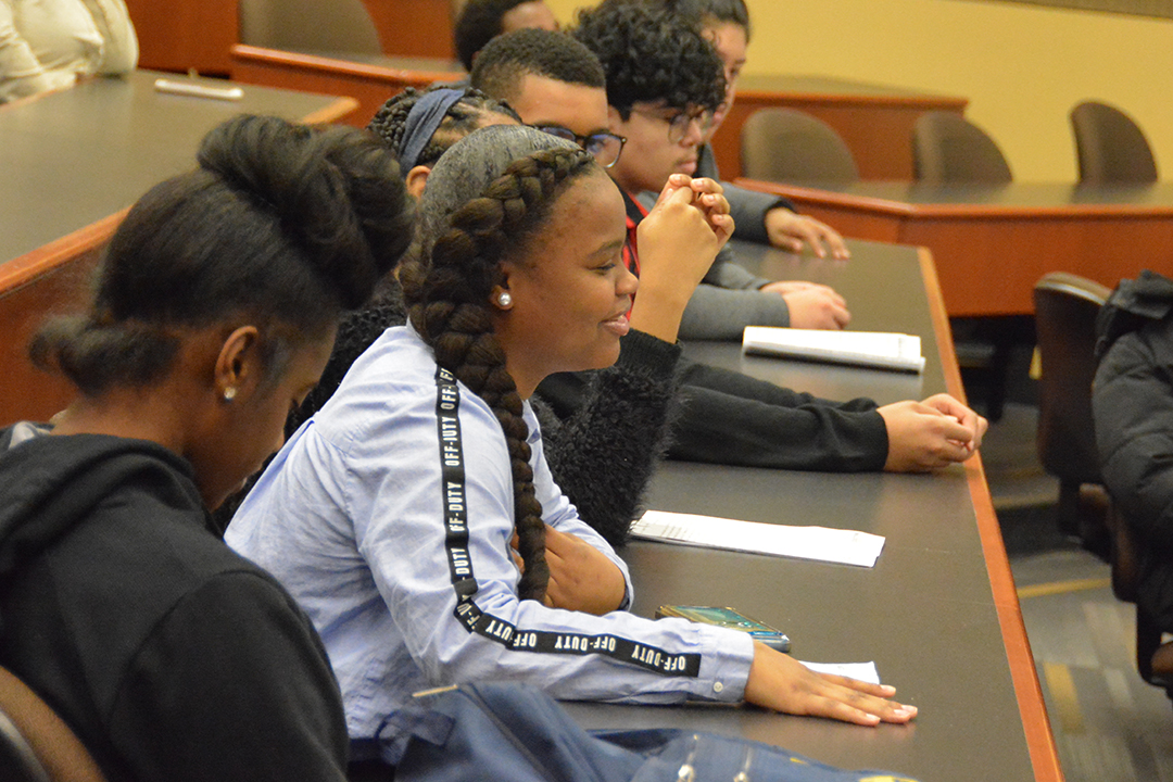 High school students listen to a panel lecture at GW Law.