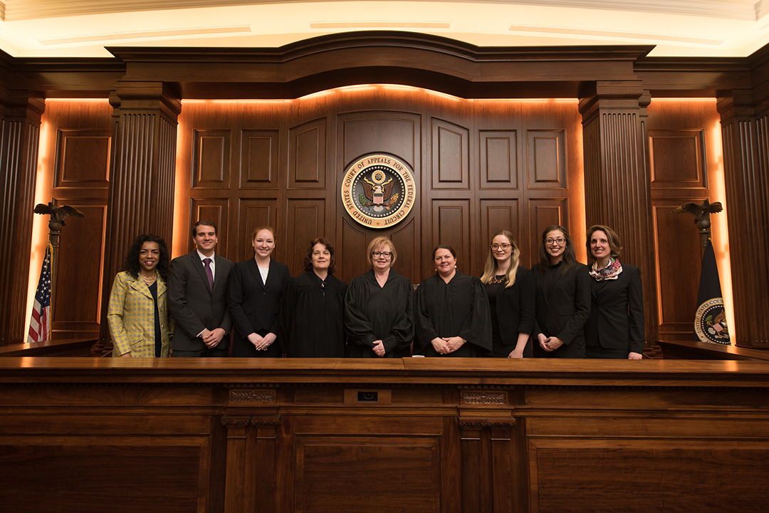Students with judges - Dentons Moot Court Competition