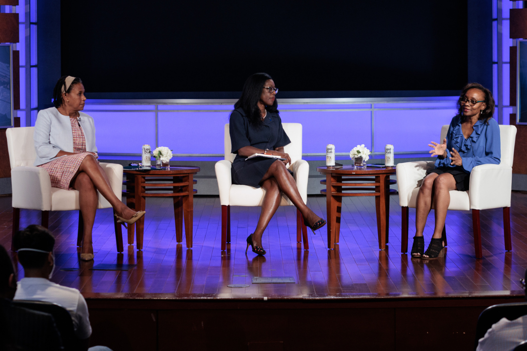 Dean Carmia N. Caesar, Dean Dayna Bowen Matthew, and Dr. Jennifer Eberhardt on stage talking