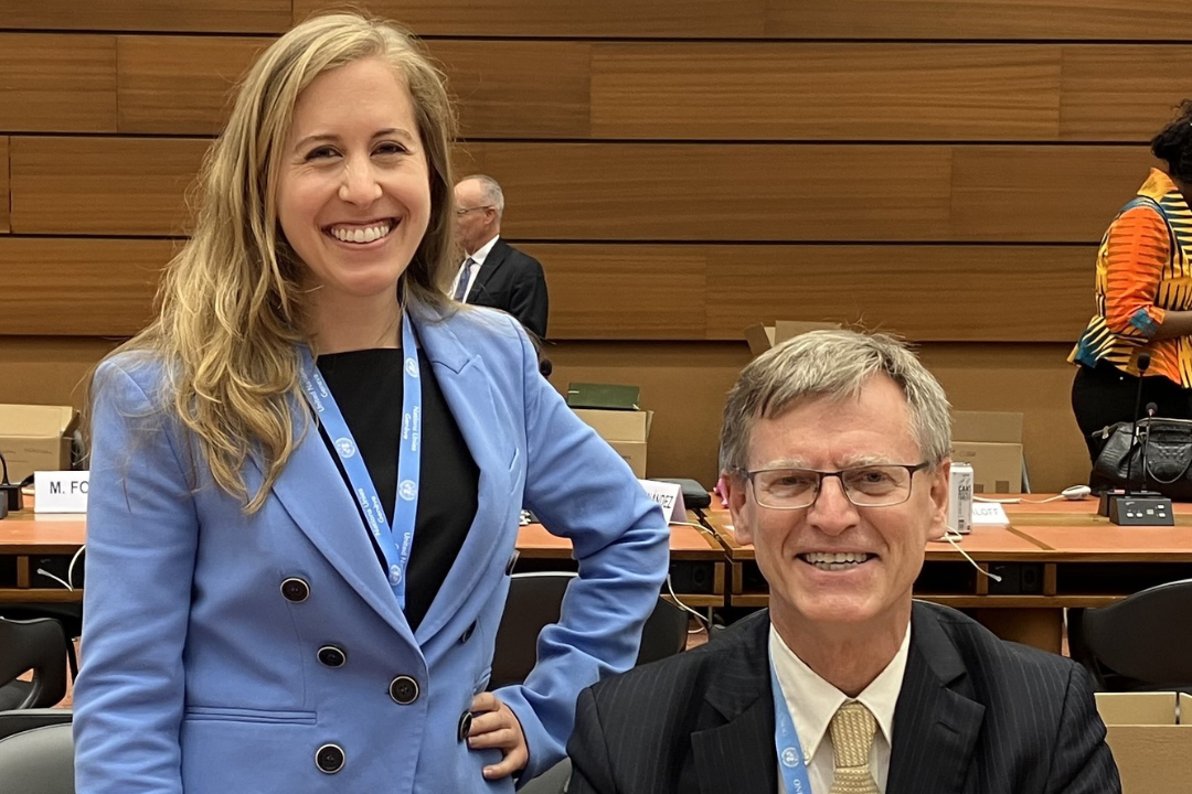 Jillian Timko standing and Sean D. Murphy sitting at the Geneva conference