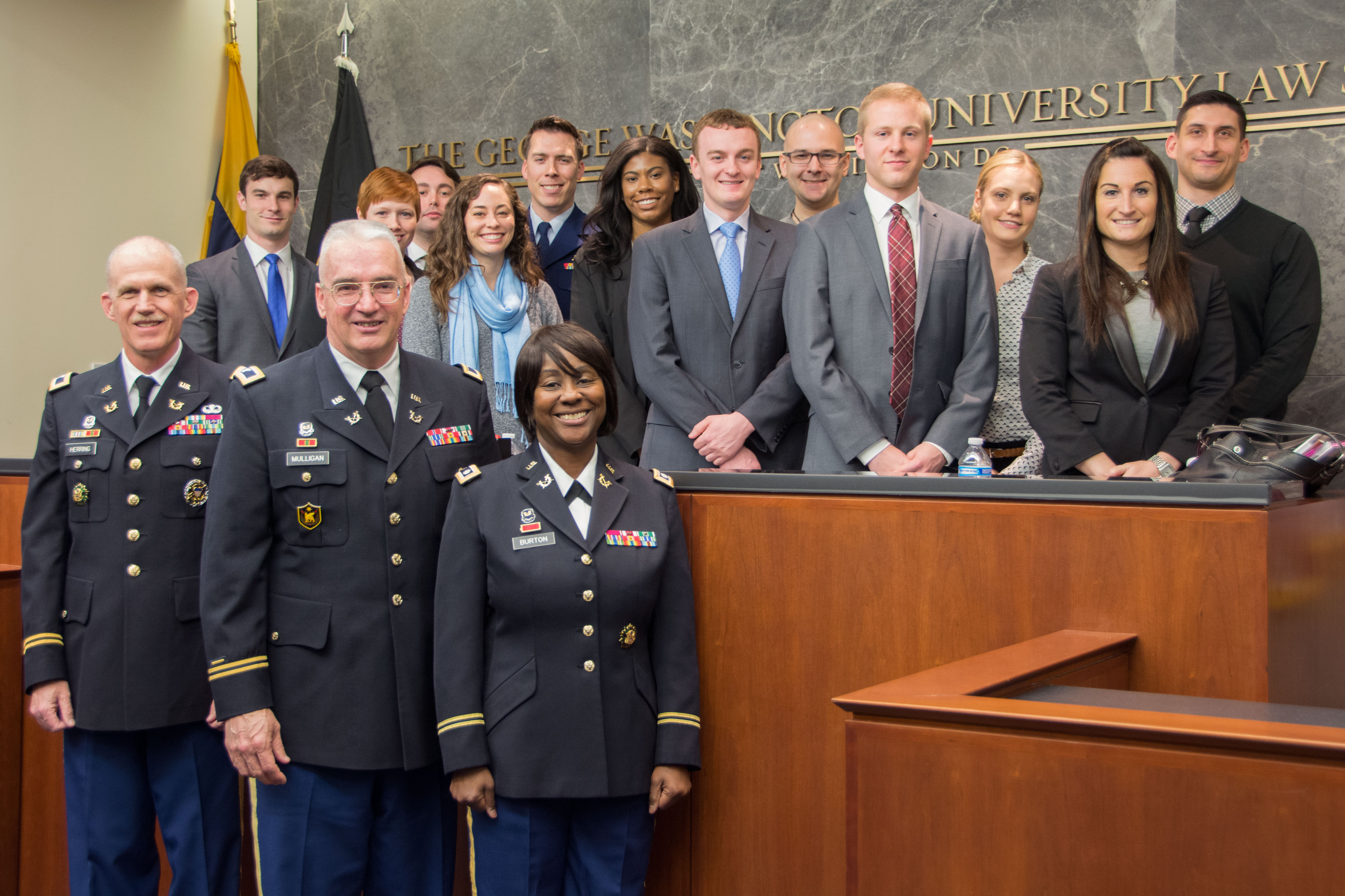 Photo of judges of the U.S. Army Court of Criminal Appeals with GW Law students.