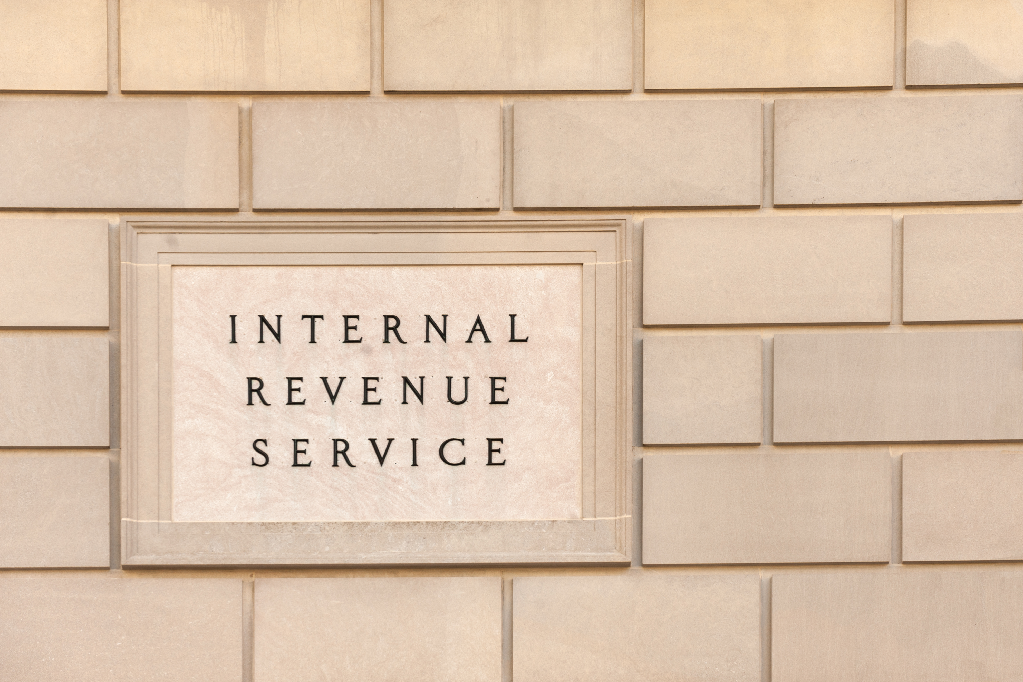 Image of a brick wall with "Internal Revenue Service" engraved