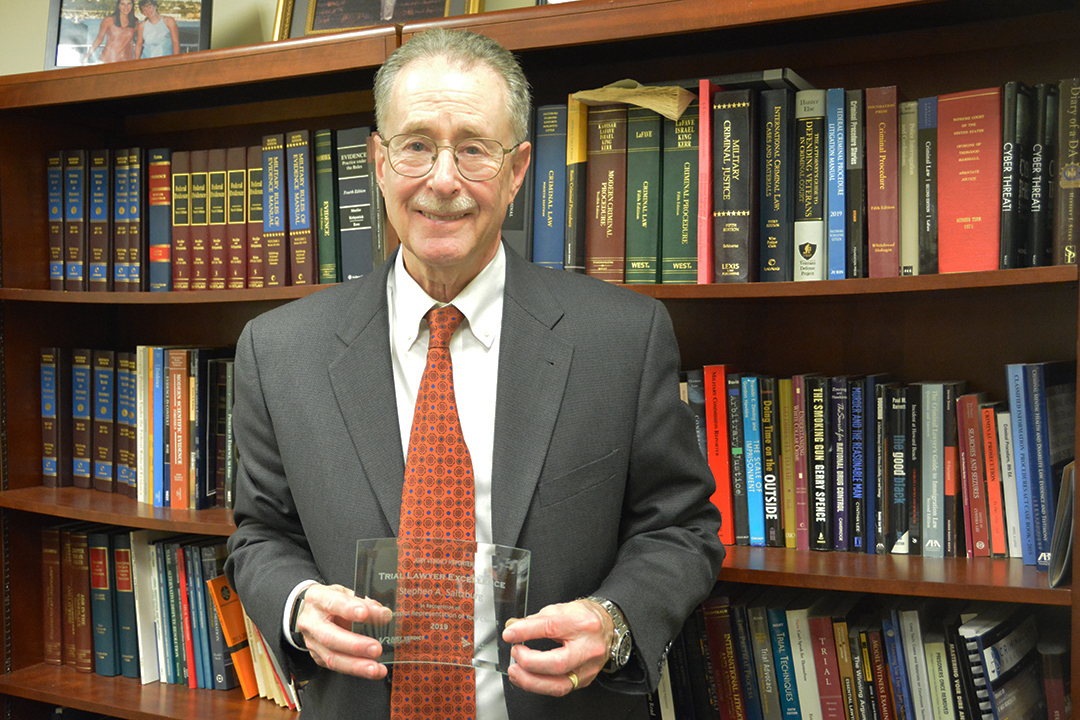 Professor Stephen A. Saltzburg poses with his Trial Lawyer Excellence Award. 